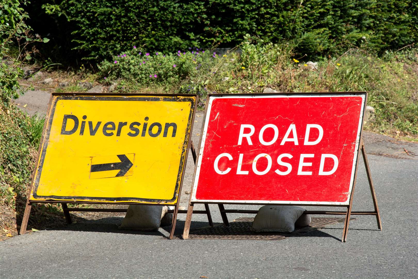 Road closed and diversion sign